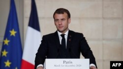 French President Emmanuel Macron looks on during a press conference with the Belgium's Prime Minister after a meeting at the Elysee Palace in Paris, on Dec. 1, 2020. 