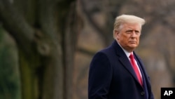 President Donald Trump walks on the South Lawn of the White House in Washington before boarding Marine One, Dec. 12, 2020.