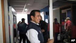 Wilson Florez, candidate of Democratic Center political party for the government of Cundinamarca, arrives at a radio station for an interview in Bogota, Colombia, Oct. 23, 2019. 