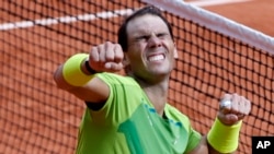 Spain's Rafael Nadal celebrates winning the French Open on Sunday. It was his 22nd major tennis championship and 14th in Paris. (AP/Jean-Francois Badias)