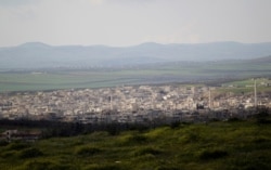 FILE - A general view shows Khan Sheikhoun in the southern countryside of Idlib, in March 2015.