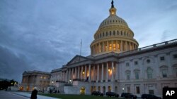 FILE - A view of the U.S. Capitol building is shown at dusk in Washington, October 2013.