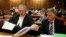 Oscar Pistorius's lawyers Barry Roux (L) and Brian Webber prepare documents before the start of the application to appeal some of his bail conditions at a Pretoria court in Pretoria, March 28, 2013. 