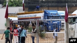 A truck carrying fuel prepares to cross into Rafah in the southern Gaza Strip on Nov.15, 2023, amid the ongoing battles between Israel and the Palestinian group Hamas.