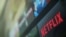 FILE - The Netflix logo is pictured on a television in this illustration photograph taken in Encinitas, Calif., Jan. 18, 2017. 