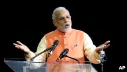 A man wears a suit with stars and an American flag tie at the 2016 Conservative Political Action Conference (CPAC) at National Harbor, Maryland.