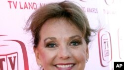 FILE - Dawn Wells arrives at the TV Land Awards in Santa Monica, Calif., June 8, 2008.