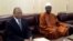 Mali's first post-war prime minister Oumar Tatam Ly (R) takes over on September 6, 2013 from interim Prime Minister Diango Cissoko (L) at a ceremony in Bamako. 