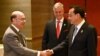 U.S. Secretary of Commerce Wilbur Ross shakes hands with China's Premier Li Keqiang, as U.S. National Security advisor Robert O'Brien watches, as they attend a bilateral meeting on the sidelines of the 35th ASEAN Summit in Bangkok, Nov. 4, 2019.
