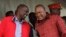 Kenyan President Uhuru Kenyatta (right) talks with Vice President William Ruto during the unveiling of a cargo train at the Mombasa, Kenya, port containers depot, May 30, 2017.