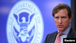 FILE - Chris Krebs, then the U.S. Department of Homeland Security Under Secretary, speaks to reporters in Arlington, Virginia, Nov. 6, 2018.
