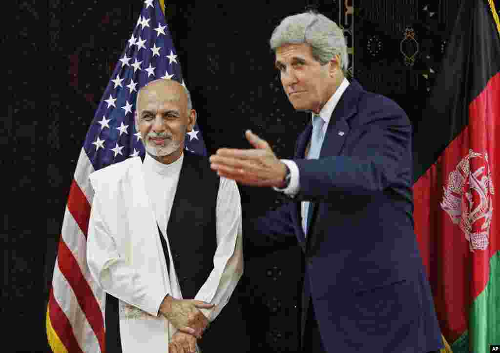 U.S. Secretary of State John Kerry meets with Afghanistan's presidential candidate Ashraf Ghani Ahmadzai at the U.S. Embassy in Kabul, July 11, 2014.