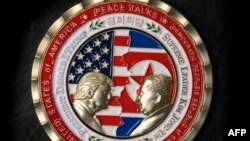  A coin for the upcoming US-North Korea summit is seen in Washington, DC, on May 21, 2018.