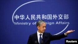 FILE - Chinese Foreign Ministry spokesman Wang Wenbin addresses reporters in Beijing, Dec. 14, 2020.