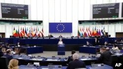 European Commission President Ursula von der Leyen delivers a speech during a plenary session at the European Parliament in Strasbourg, eastern France, Dec. 15, 2021.