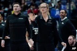 FILE - Many women are able to go to school and play sports at Vanderbilt University because of Title IX. Vanderbilt head coach Shea Ralph, center, at the women's Southeastern Conference tournament Wednesday, March 2, 2022, in Nashville, Tenn. (AP Photo/Mark Humphrey)