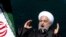 Iranian President Hassan Rouhani speaks during a ceremony celebrating the 41st anniversary of the Islamic Revolution, at Azadi (Freedom) Square in Tehran, Iran, Feb. 11, 2020.