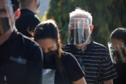 A retired doctor from the public health system stands in a line as he waits to be inoculated with the Sputnik V COVID-19 vaccine, as part of a vaccination campaign in Tegucigalpa, Honduras, April 23, 2021.