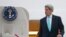 U.S. Secretary of State John Kerry disembarks from his plane as he arrives in Geneva, Switzerland, Sunday, March 15, 2015.