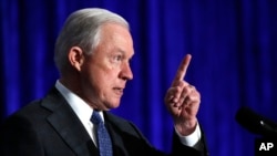 FILE - Attorney General Jeff Sessions speaks in Bethesda, Maryland, June 21, 2017. Sessions is visiting the Guantanamo Bay detention facility, which he has called a fine place to house new terrorism suspects.