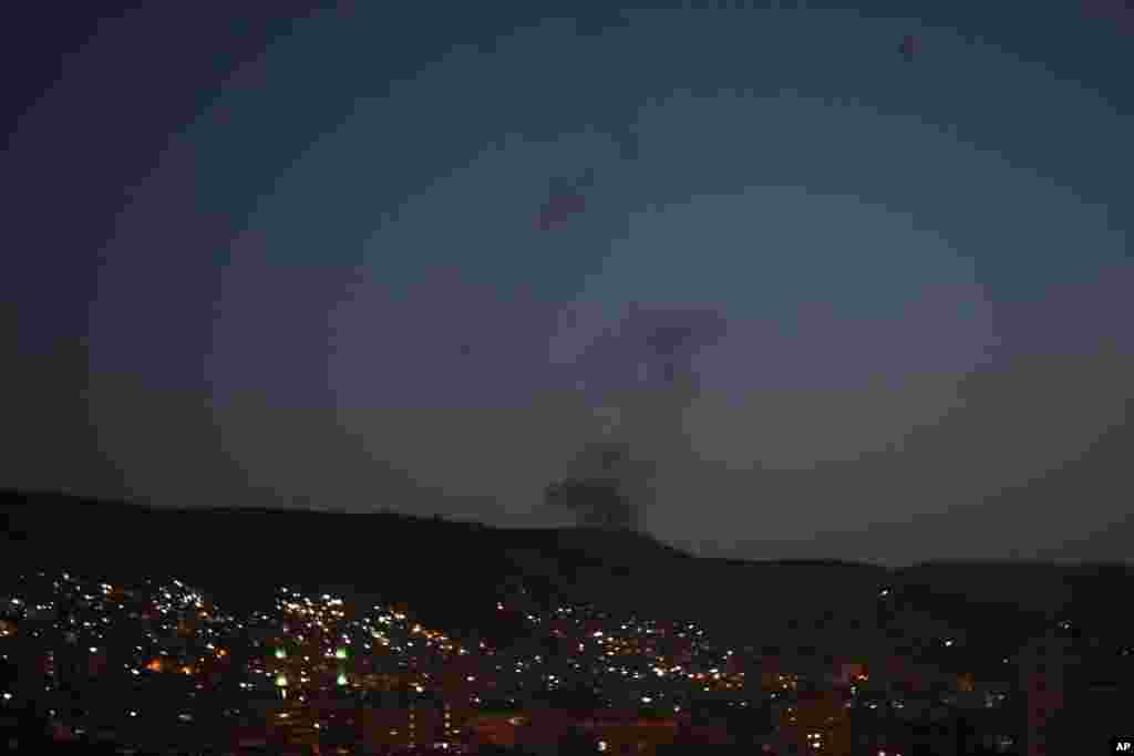 Smoke rises after airstrikes targeting different parts of the Syrian capital Damascus, Syria, April 14, 2018.