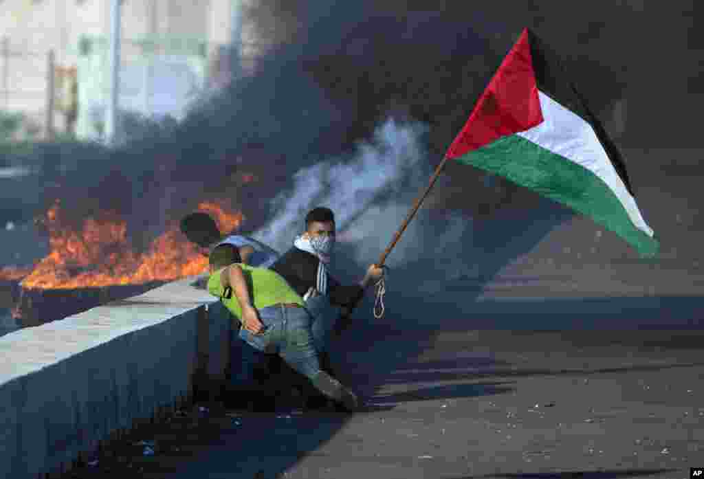 Palestinians protest at the entrance of Erez border crossing between Gaza and Israel, in the northern Gaza Strip.