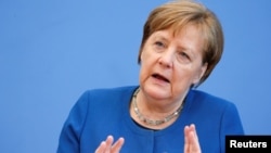 លោក​ស្រី អធិការបតី​អាល្លឺម៉ង់ Angela Merkel ថ្លែង​ក្នុង​សន្និសីទ​សារព័ត៌មាន អំពី​វីរុស​កូរ៉ូណា នៅ​ទីក្រុង​ប៊ែឡាំង ប្រទេស​អាល្លឺម៉ង់ កាល​ពី​ថ្ងៃ​ទី​១១​ មីនា ២០២០។