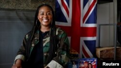 Ishea Brown, who plans to hold a Royal wedding viewing party with 19 of her friends, complete with fascinators and Hennessy, poses for a portrait at her apartment in Seattle, Washington, May 14, 2018. 