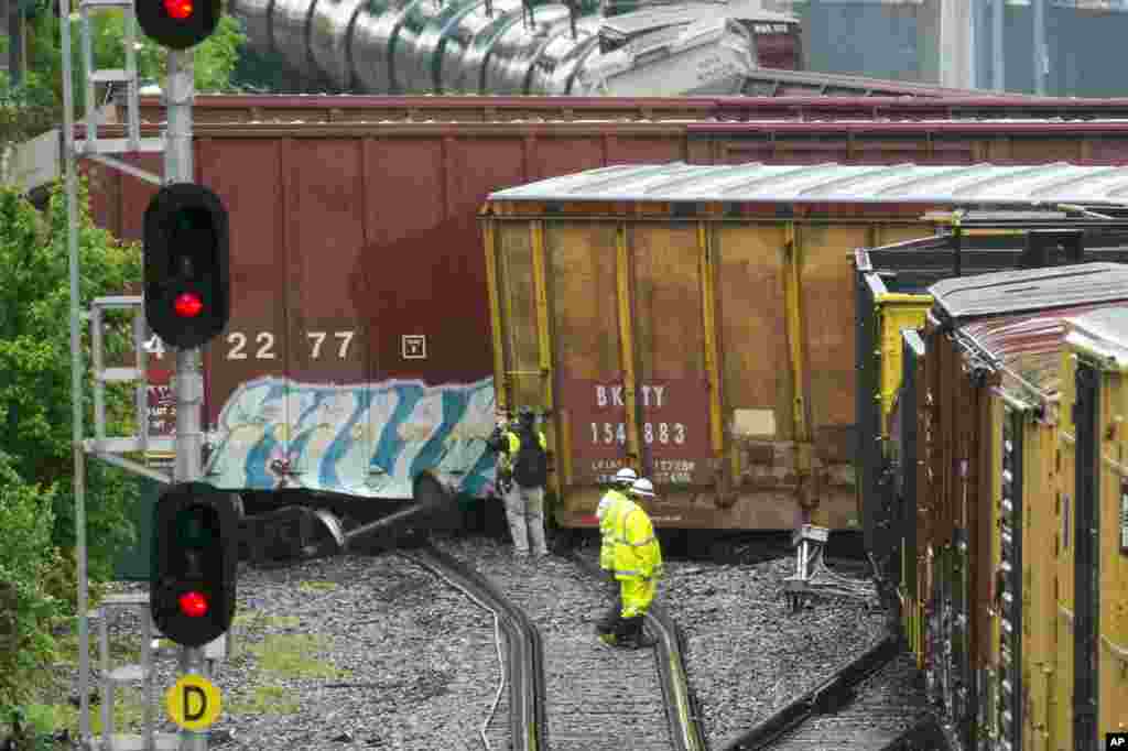 Several cars remain overturned after a CSX freight train derailed near a Metro stop in Washington, D.C.