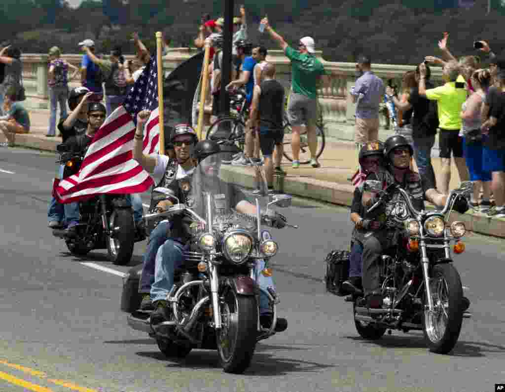 Participants in the annual Rolling Thunder motorcycle rally ride past Arlington Memorial Bridge, Washington, May 29, 2016.