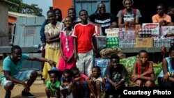 Staff of an Accra promotional firm, Team Tiki, donate proceeds from a recent event to the M'adamfo Pa Orphanage. (Courtesy Team Tiki)