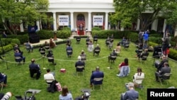 特朗普总统2020年5月11号在白宫玫瑰园召开新冠病毒疫情记者会。（路透社提供）