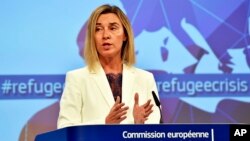 EU High Representative For Foreign Affairs and Security Policy Federica Mogherini, talks to the media prior an emergency EU heads of state summit on migration at the EU Commission headquarters in Brussels, Sept. 23, 2015. 