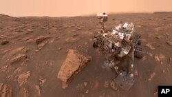 This composite image made from a series of June 15, 2018 photos shows a self-portrait of NASA's Curiosity Mars rover in the Gale Crater. (NASA/JPL-Caltech via AP)