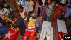 Mourners attend a joint funeral of three protesters, who were shot dead the day before by security forces during a crackdown anti-military coup demonstrations in Kawthaung in southern Myanmar. (Credit: Dawei Watch) 