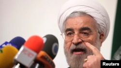 Hasan Rowhani speaks during a campaign rally in Tehran, May 30, 2013.
