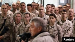U.S. troops listen to U.S. Defense Secretary Chuck Hagel as he speaks at Camp Bastion, Helmand Province December 8, 2013. 