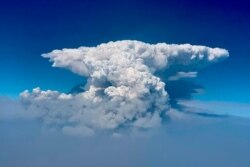 In this photo taken with a drone provided by the Bootleg Fire Incident Command, a pyrocumulus cloud, also known as a fire cloud, is seen over the Bootleg Fire in southern Oregon, July 14, 2021.