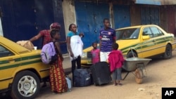 People wait to get to the ferry heading towards Senegal from Gambia's capital Banjul, Jan. 17, 2017. 