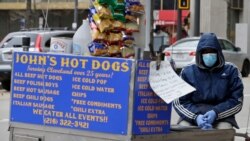 Percy Johnson waits for a customer at Public Square in Cleveland, April 23, 2020. With so few pedestrians downtown, Johnson said business is slow.