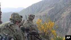 Paratroopers in Bermel spend hours tracking suspected Taliban and mapping their fighting positions, May 2011