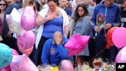  Olivia Campbell's mother, Charlotte Campbell (center) and stepfather, Paul Hodgson (foreground), pay tribute to the victims of the explosion outside Manchester Arena, at St Ann's Square after leading a bikers convoy from their home town of Bury in central Manchester, England, May 25 2017.
