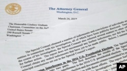 FILE - The letter that Attorney General William Barr sent to Congress on the conclusions reached by special counsel Robert Mueller in the Russia probe is photographed on March 24, 2019. 