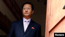 North Korea's ambassador in Peru Kim Hak-Chol walks to meet the media to reads a statement after he was expelled by Peruvian government, in Lima, Peru, Sept. 12, 2017.