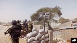 FILE - Cameroon soldiers stand guard at a lookout post near the village of Fotokol as they take part in operations against the Islamic extremists group Boko Haram, Feb. 25, 2015.