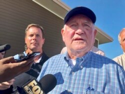 FILE - U.S. Agriculture Secretary Sonny Perdue speaks to reporters during a visit to Decatur, Ill., Aug. 28, 2019.