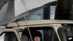 In this video image broadcast on Libyan state television early Tuesday Feb. 22, 2011, Libyan leader Moammar Gadhafi is shown.