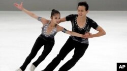 FILE - Ryom Tae Ok and Kim Ju Sik of North Korea compete during the pairs short program at the Figure Skating-ISU Challenger Series in Oberstdorf, Germany, Sept. 28, 2017. 