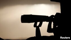 A Turkish soldier watches the Turkish-Syrian border near the southeastern town of Suruc, Sept. 24, 2014.