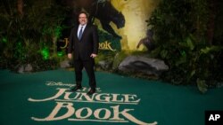 Director Jon Favreau poses for photographers upon arrival at the European premiere of the film "The Jungle Book" in London, April 13, 2016. 
